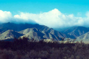 Clouds top the mountains that surround Vallecito after a spring rain.