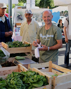 Selling the produce cut by the author at the market in Corsica.