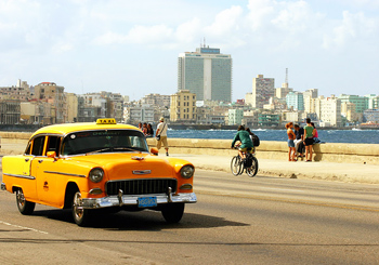 Vintage cabs are part of the street life in Cuba.