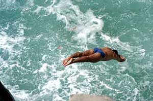 The cliffdivers you've heard about collect tips on their way back up the hill. photos by Mandana Marsh.