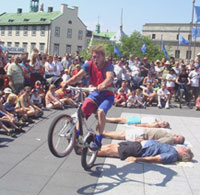 An acrobat performs in the city center