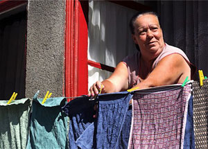 A woman hangs her wash out to dry in Porto, Portugal. Photos by Paul Shoul