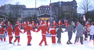 Ice skating santas on Avenyn, the main drag of Gothenburg, Sweden. Max Hartshorne photo.