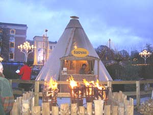 Outside of the shops at Liseberg, an amusement park and Christmas market, include lots of fires and candles.