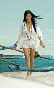 A model takes a break from a photo shoot at Alona Beach. 