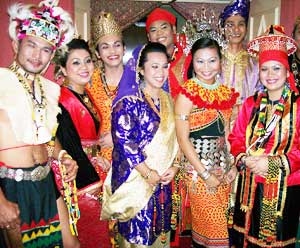 The hotel staff prepares Iban dances for the Rainforest World Music Festival in Kuching, Malaysia - photos by Max Hartshorne