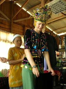 Getting fitted with a Bajau costume
