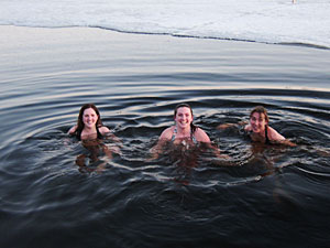 The author (center) takes the plunge into freezing cold water