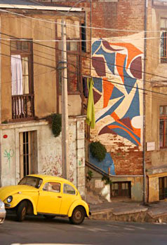 One of the 20 murals that are part of the Museo a Cielo Abierto brightens up a wall along Subida Ferrari.
