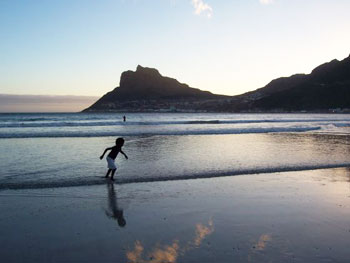 A view like this, of the Hout Bay beach at dusk, will cost you absolutely nothing 