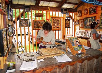 At the market, we met this lady who can take a block of wood and convert into a work of art.