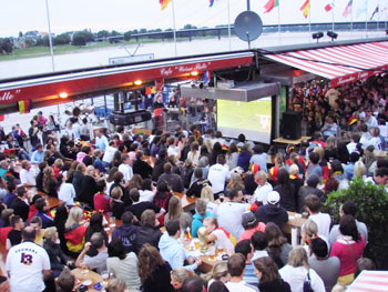 Football fans drinking beer on the Rhine