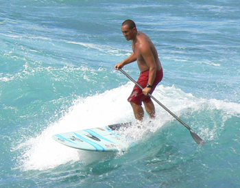 A paddle surfer along the road to Hana, Maui, Hawai'i. photos by Max Hartshorne
