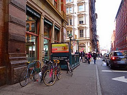 Bikes parked all day in SoHo.