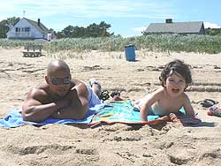 Enjoying the beach, father and son.