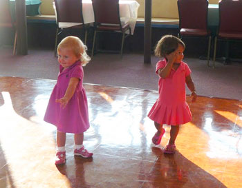 Sofie dances with a friend in the galley of the ship