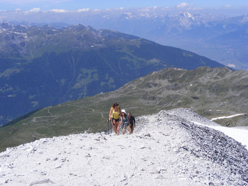 My kids, 13 and 16, arriving at the Bella Tolla summit with their uncle. They're fit but not exceptional and could have done this hike as young as 5. They've done tougher (if lower) summits many times in Scotland and New England.