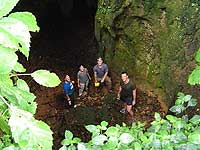 Standing near the entrance to the caves.