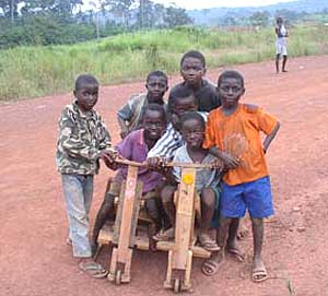 A group of kids on the Congo side of the border with their home-made scooters. Photos by Will Sparks