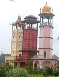 Towers at the entrance to the city of Malacca, symbolizing the Malay, Chinese and Indian cultures that blend into one. photo by Max Hartshorne