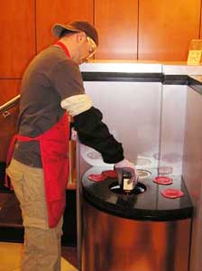 Dipping a bottle into the famous red wax at Maker’s Mark