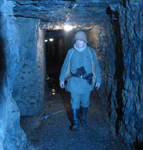 WW I reenactor Serge Tourovsky eerily recreates the vision of a German soldier in the tunnels of Moreau Valley Camp.