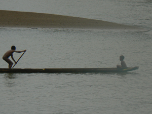 Boys in a dugout canoe, the preferred method of transport on the Pacific coast of Colombia.