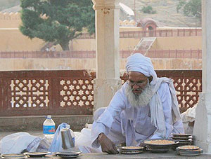 Selling pigeon feed at the Amber Fort