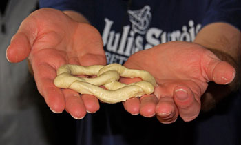 Close-up of a hand-twisted pretzel