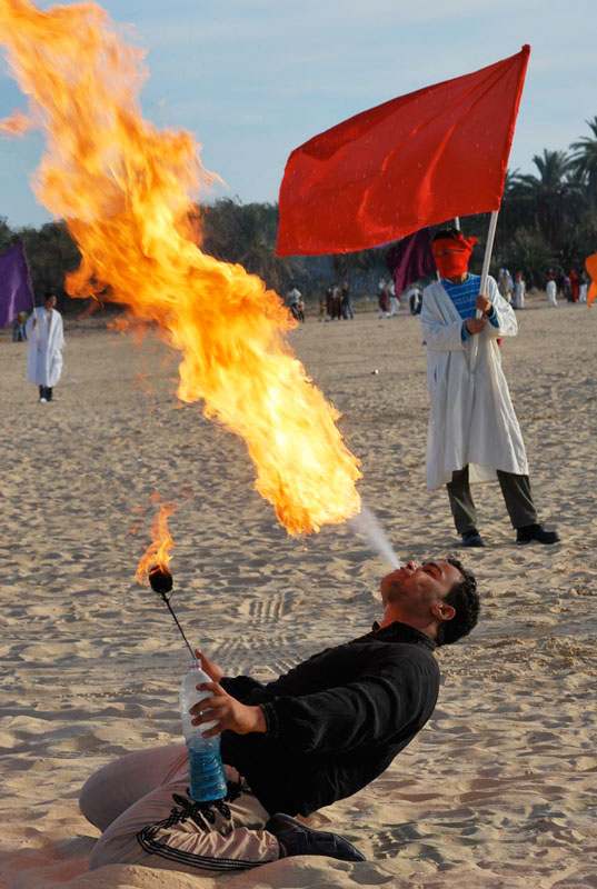 A fire-breathing performer at the Tozeur Oasis Festival
