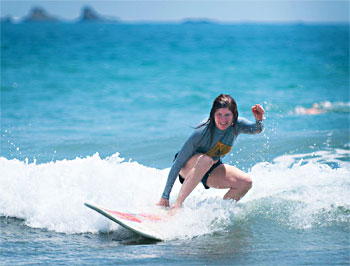 After a few shaky rides, Molly gets the hang of surfing. Photos by Ben Barnhart.