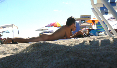 Couple sunbathing at Haulover Beach photos