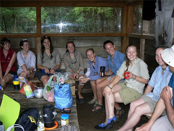 University girls who hiked the trail in six days, in the hut at Blanket Bay.