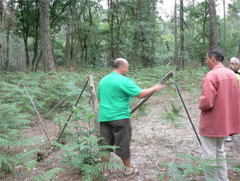 Eurl Jean-Marie Bitaube shows us the net that is used to trap palombes, who in turn are used as decoys to lure other birds into shooting range. photos by Max Hartshorne.