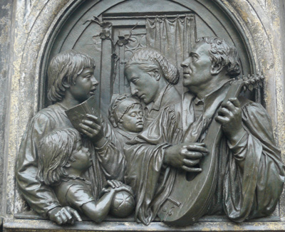 Martin Luther plays the lute with his wife and family. Relief from the Luther Memorial at Eeisleben. Photos by Stephen Hartshorne.