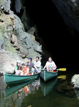 Canoeing through caves in Belize.