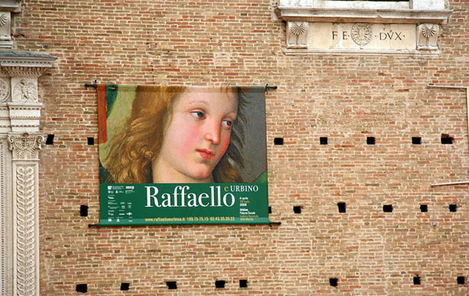 Poster on the wall in Urbino, Italy