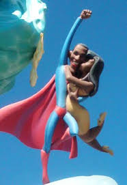 cape and all, fly high in the sky with wife Michele grasped tightly in his arms.