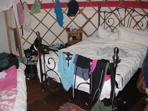 Bed and places for clothing in the yurt.