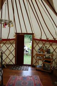 The comfortable inside of a yurt on the Isle of Wight.