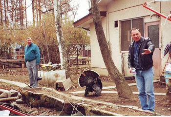 A feathered imposter and guests Monsignor Sanner and Dennis Lid