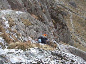 A climber scaling the icy cliffs of Cwm Idwal (photo by Abbey Stirling) 