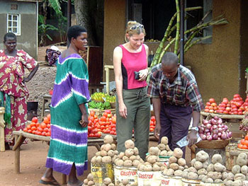 Marie Javins shops at a market in Uganda.