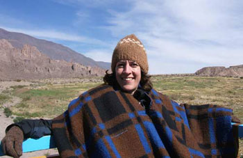 Polly Evans wraps herself in wool to ward off the chilly air outside the city of Salta in northern Argentina.