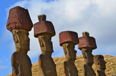 Many of the statues are side by side with headdresses.