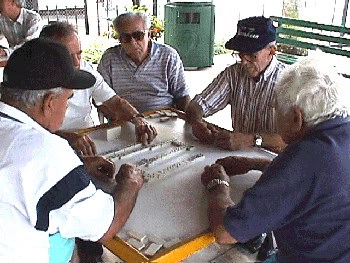 Abuelitos playing another intense game of domino in Domino Park. Photo by School of Education, University of Miami.