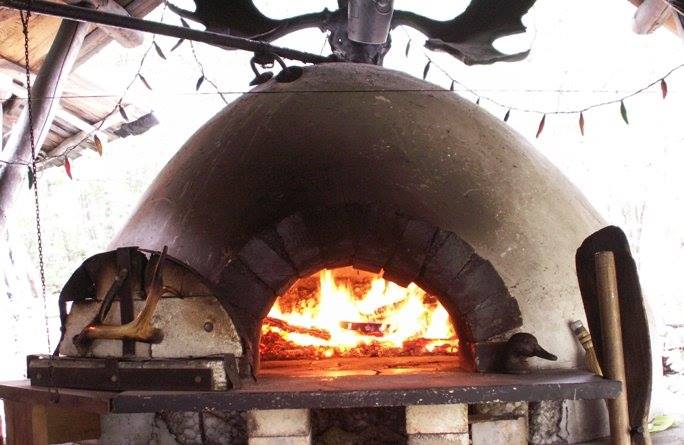 The brick oven that cooks pizza and other delights at the Holler.