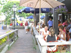 Martha's Vineyard and Nantucket MA 8 Enjoying cocktails at the Tavern, on Straight Wharf, Nantucket.