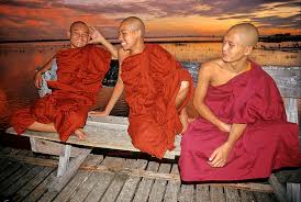 Burma's Buddhist Monuments 3 Monks on a bridge. Photo by Gina Reisner