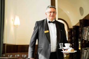 Professional cafe waiter at Cafe Landtmann in Vienna Austria.